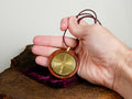 ENGRAVED SOLID BRASS  Chartres Labyrinth, polished, leather cord